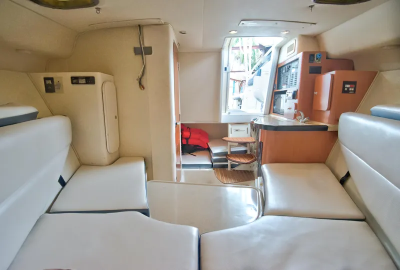 Slide: The Image of 2006 Hydra-Sports Vector 3300 VX cabin interior with seating and kitchenette. - 32