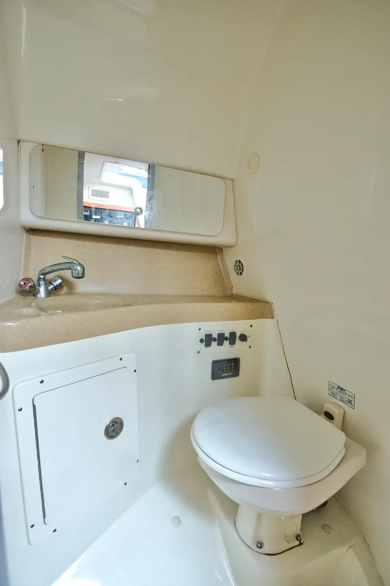 Slide: The Image of 2006 Hydra-Sports Vector 3300 VX boat bathroom with sink and toilet. - 33
