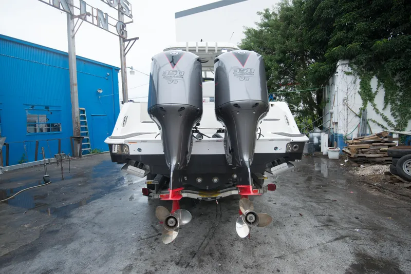 Slide: The Image of 2006 Hydra-Sports Vector 3300 VX with twin outboard engines in a boatyard. - 7