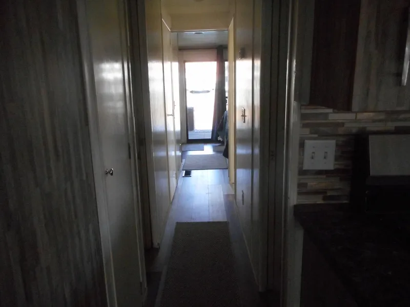 Slide: The Image of Narrow hallway inside 2000 Stardust Cruisers Pure Enchantment Share #27 houseboat. - 14