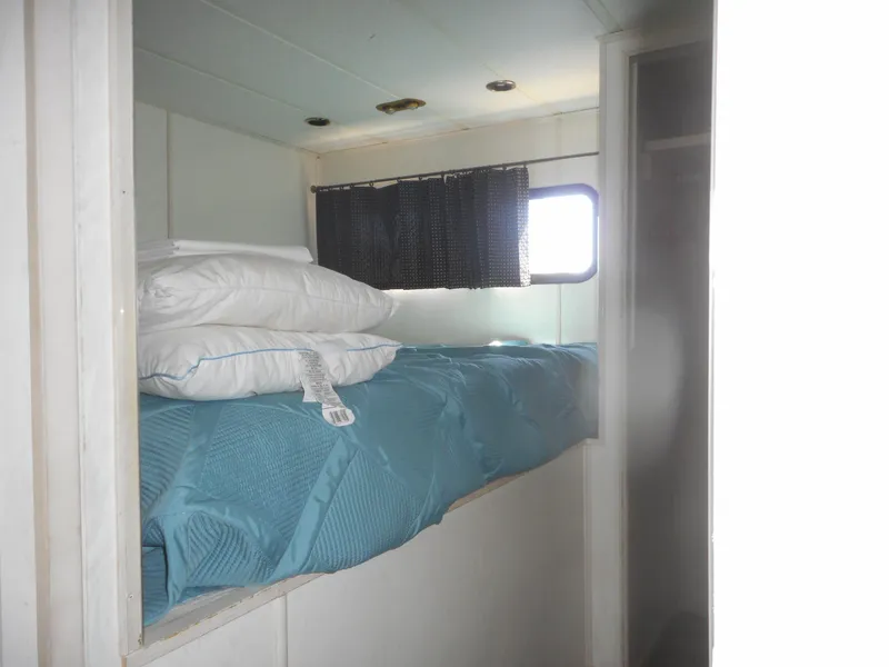 Slide: The Image of Cozy cabin bed in 2000 Stardust Cruisers Pure Enchantment Share #27 houseboat. - 15