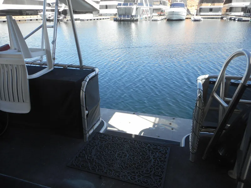 Slide: The Image of Houseboat deck view with water and docked boats, Stardust Cruisers Pure Enchantment, 2000 model. - 26