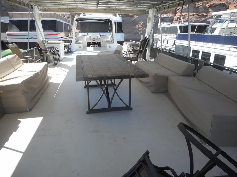 Slide: The Image of Spacious deck of 2000 Stardust Cruisers houseboat with seating and table. - 29