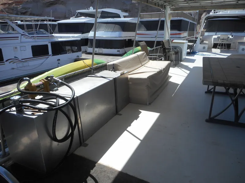 Slide: The Image of Houseboat deck with seating, table, and equipment, Stardust Cruisers Pure Enchantment Share #27, 2000 model. - 30