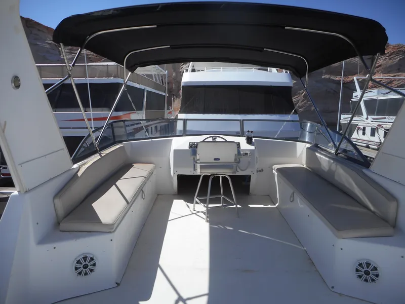 Slide: The Image of 2000 Stardust Cruisers Pure Enchantment Share #27 boat interior with seating and steering area. - 34