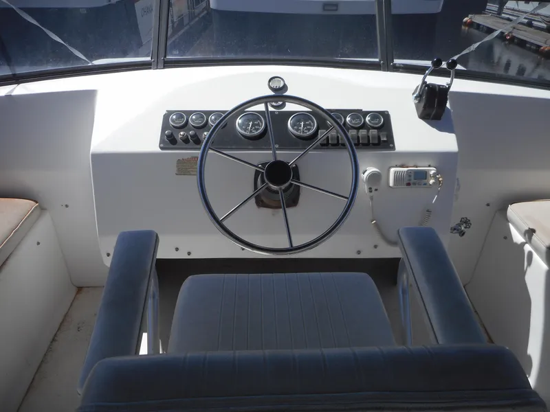 Slide: The Image of Helm of 2000 Stardust Cruisers Pure Enchantment Share #27 houseboat with steering wheel and controls. - 35
