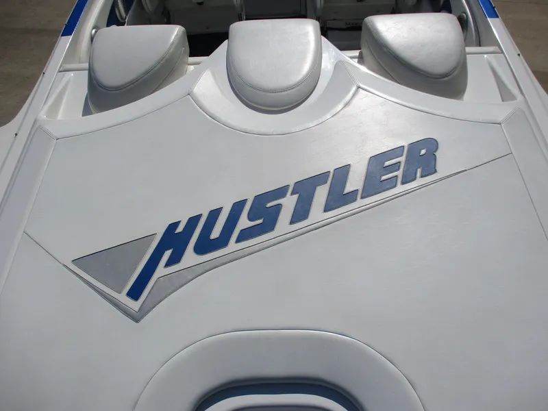 Slide: The Image of 2002 Hustler 388 SLINGSHOT boat interior with logo. - 10
