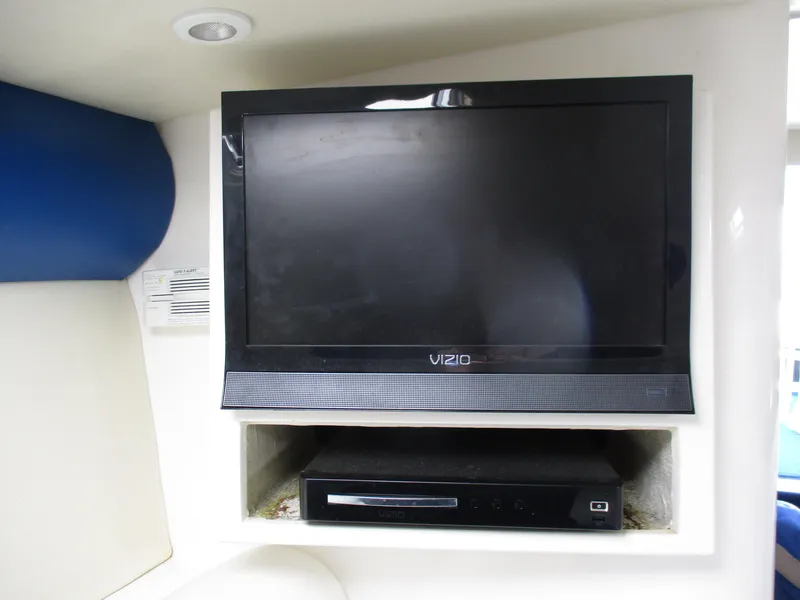 Slide: The Image of Flat-screen TV and DVD player in 2002 Hustler 388 SLINGSHOT boat interior. - 23