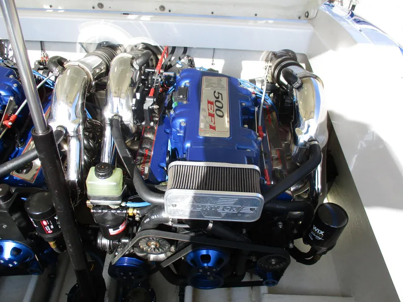 Slide: The Image of 2002 Hustler 388 SLINGSHOT engine compartment with powerful 500 EFI engine. - 28