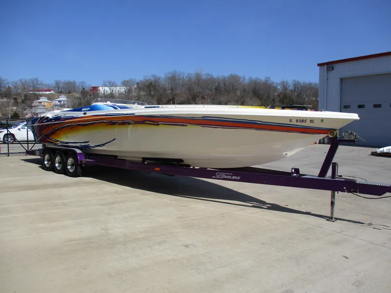 Slide: The Image of 2002 Hustler 388 SLINGSHOT powerboat on a purple trailer. - 4