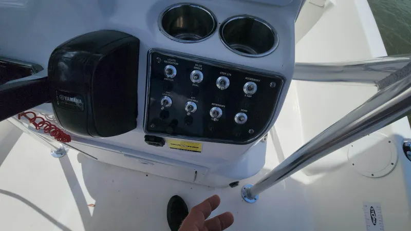 Slide: The Image of Control panel of a 2020 NauticStar 2140 Sport boat with Yamaha throttle. - 13