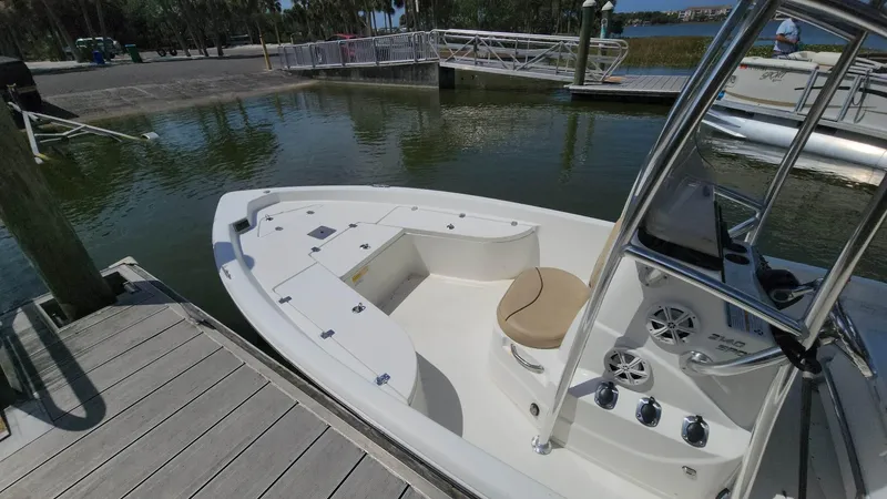 Slide: The Image of 2020 NauticStar 2140 Sport boat docked at marina. - 17