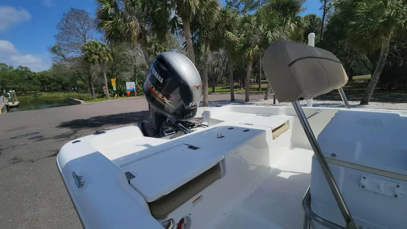 Slide: The Image of 2020 NauticStar 2140 Sport boat with Yamaha outboard motor in a scenic park. - 19