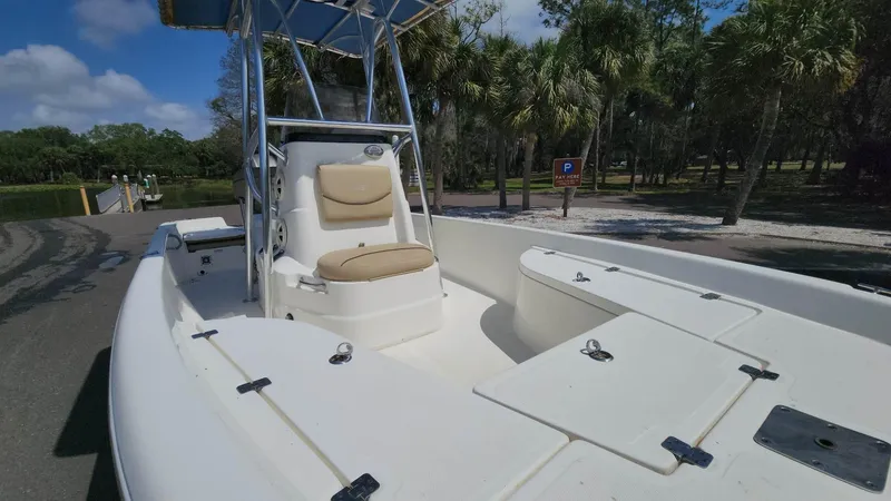 Slide: The Image of 2020 NauticStar 2140 Sport boat with seating and storage compartments. - 24