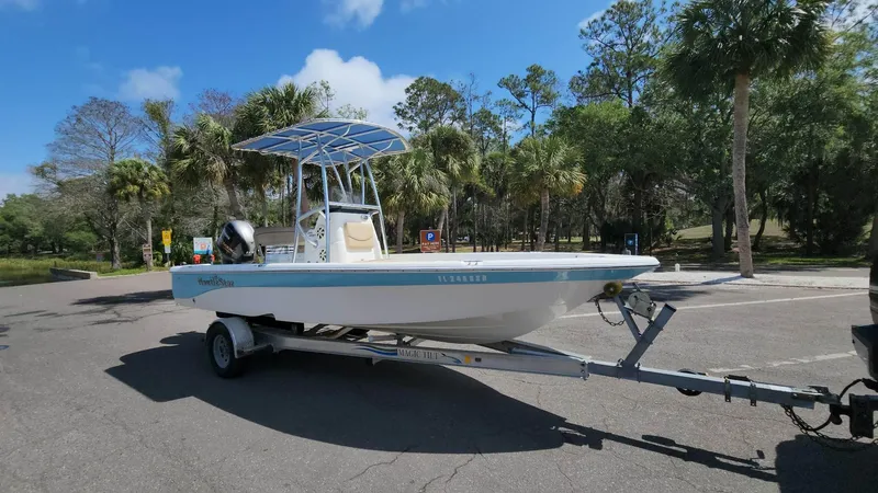 Slide: The Image of 2020 NauticStar 2140 Sport boat on trailer in sunny parking lot. - 26