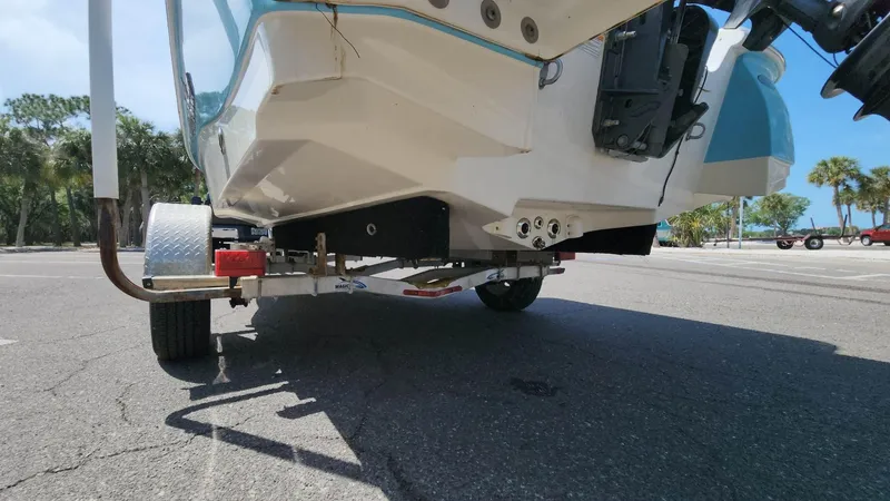 Slide: The Image of 2020 NauticStar 2140 Sport boat on trailer, rear view. - 29