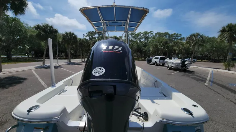 Slide: The Image of 2020 NauticStar 2140 Sport boat with 115 horsepower engine in a parking lot. - 31