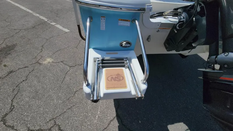 Slide: The Image of NauticStar 2140 Sport 2020 boat swim platform with ladder and logo. - 33