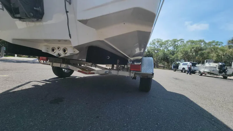 Slide: The Image of 2020 NauticStar 2140 Sport boat on trailer, rear view. - 34