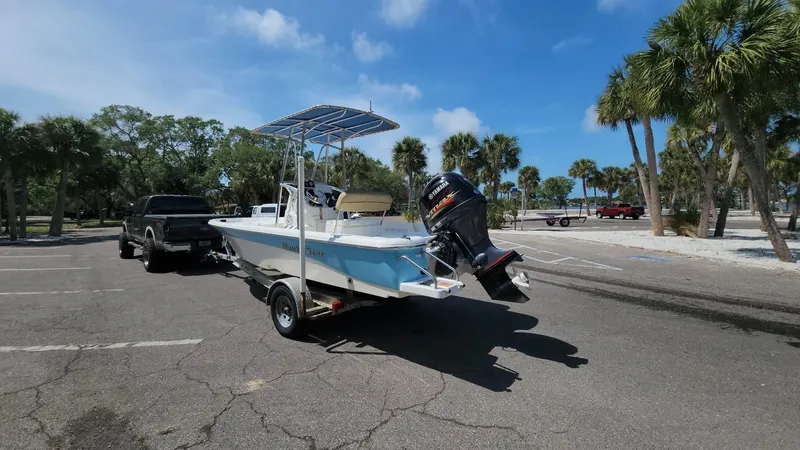 Slide: The Image of 2020 NauticStar 2140 Sport boat on trailer in sunny parking lot. - 41