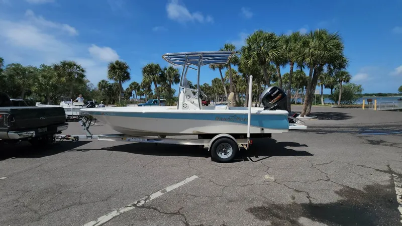 Slide: The Image of 2020 NauticStar 2140 Sport boat on trailer in sunny parking lot. - 42
