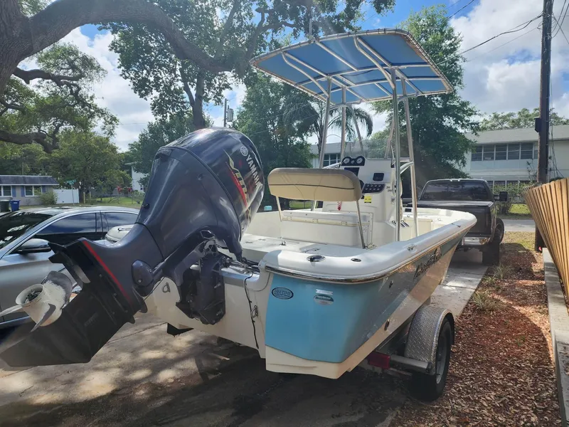 Slide: The Image of 2020 NauticStar 2140 Sport boat with outboard motor on trailer. - 44