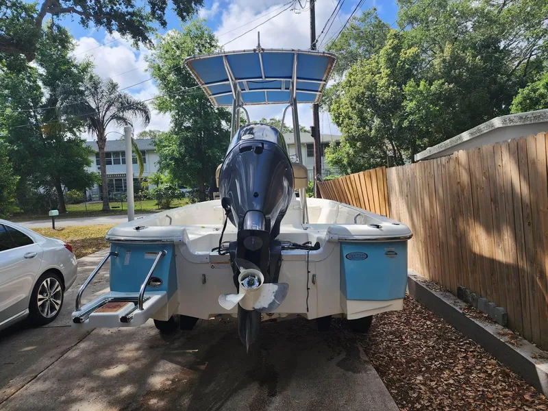 Slide: The Image of 2020 NauticStar 2140 Sport boat with outboard motor in driveway. - 45
