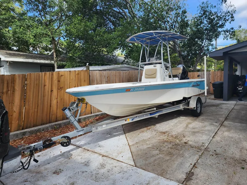 Slide: The Image of 2020 NauticStar 2140 Sport boat on trailer in driveway. - 48