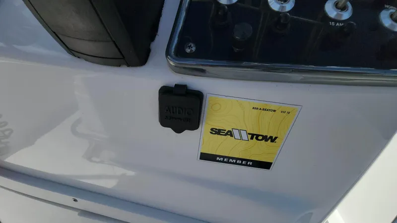 Slide: The Image of 2020 NauticStar 2140 Sport dashboard with Sea Tow member sticker. - 8