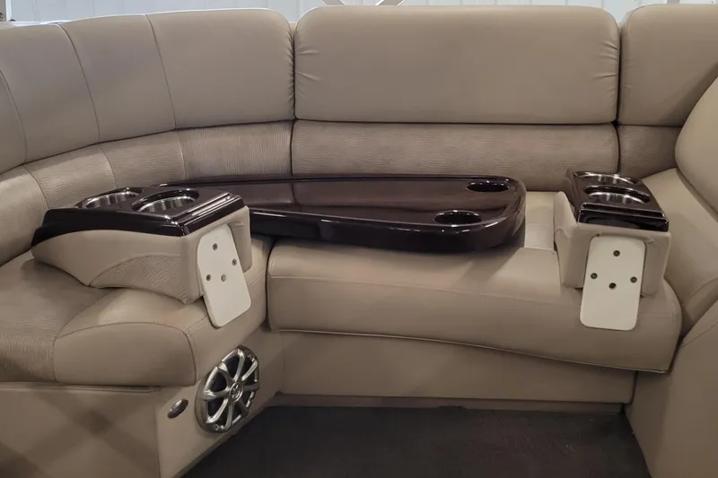 Slide: The Image of Luxurious seating area in a 2011 Bennington 2575 RCW 3 I/O boat with cup holders and speakers. - 11