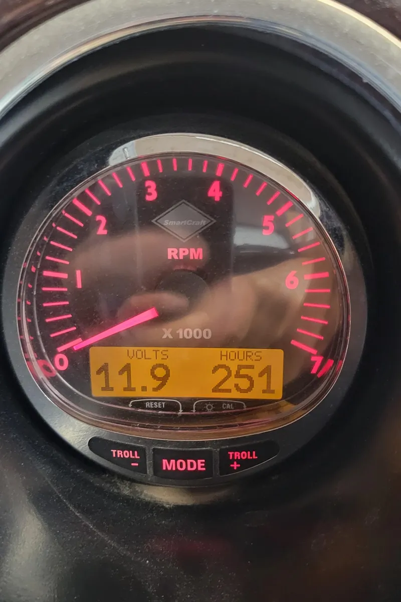 Slide: The Image of Close-up of a 2011 Bennington 2575 RCW 3 I/O RPM gauge displaying 11.9 volts and 251 hours. - 17