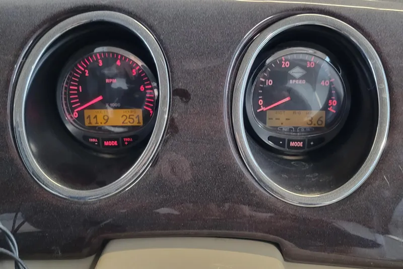 Slide: The Image of Dashboard gauges of a 2011 Bennington 2575 RCW 3 I/O boat, showing RPM and speed. - 18