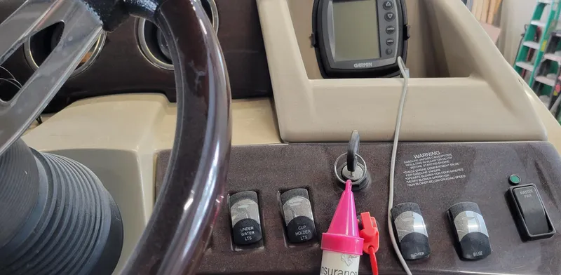 Slide: The Image of Steering wheel and control panel of 2011 Bennington 2575 RCW 3 I/O boat. - 19