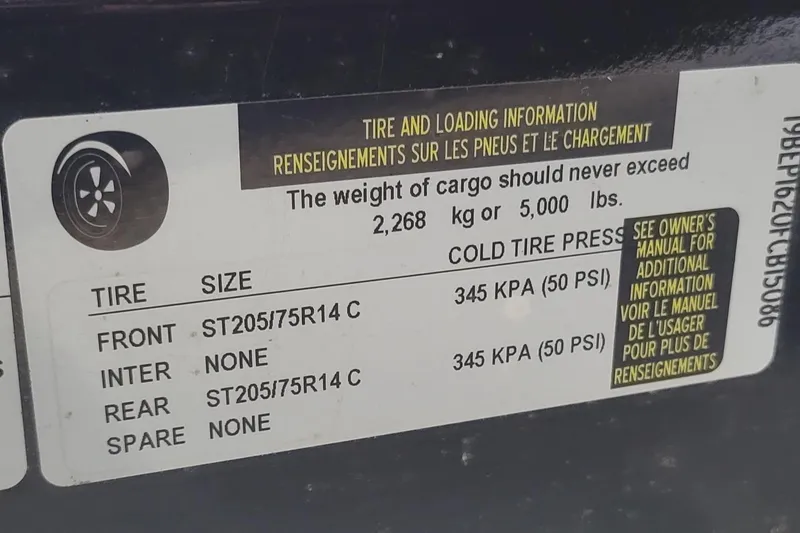 Slide: The Image of Tire and loading information label for 2011 Bennington 2575 RCW 3 I/O, showing tire sizes and pressure. - 22