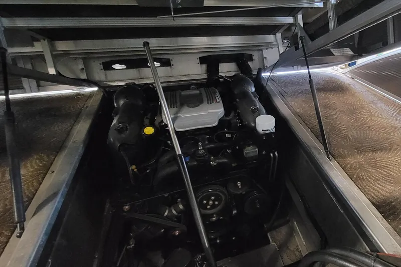 Slide: The Image of Engine compartment of a 2011 Bennington 2575 RCW 3 I/O boat, showcasing internal components. - 24