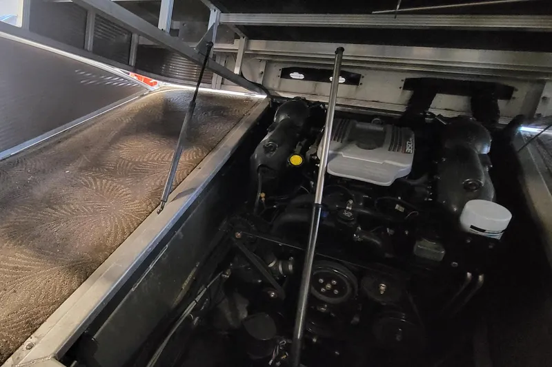 Slide: The Image of Engine compartment of a 2011 Bennington 2575 RCW 3 I/O boat, showing detailed components. - 25