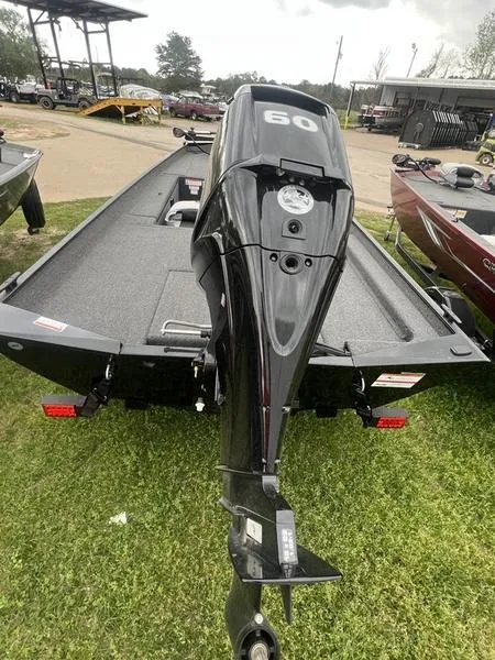 Slide: The Image of 2023 Crestliner 1700 Storm boat with 60 HP outboard motor, rear view. - 3
