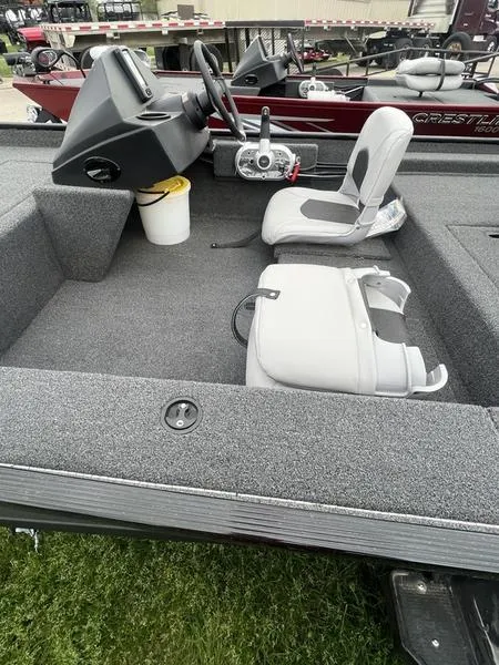 Slide: The Image of 2023 Crestliner 1700 Storm fishing boat interior with steering console and seating. - 6