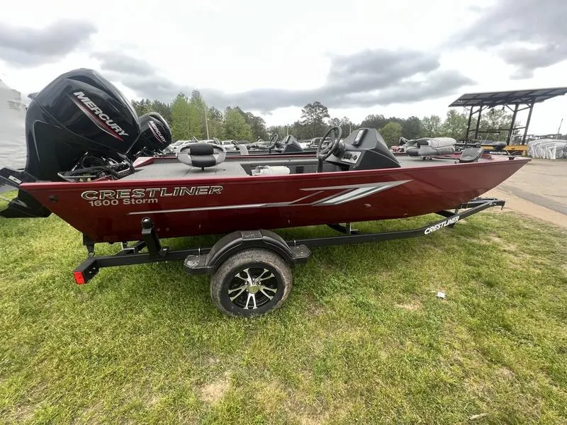 The Image of 2023 Crestliner 1600 Storm fishing boat on trailer with Mercury outboard motor. - 1