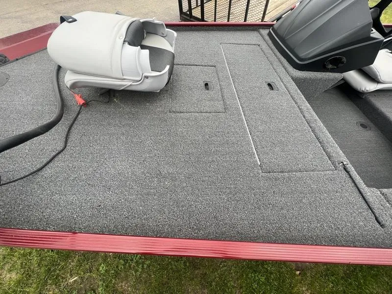 Slide: The Image of 2023 Crestliner 1600 Storm boat deck with gray carpet and seating. - 4