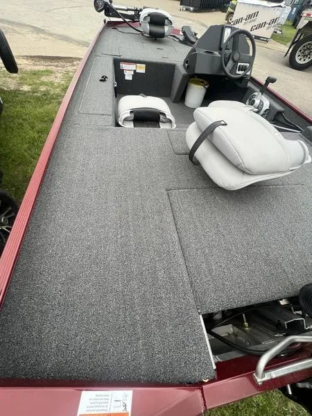 Slide: The Image of 2023 Crestliner 1600 Storm fishing boat with gray carpeted deck and seating. - 7