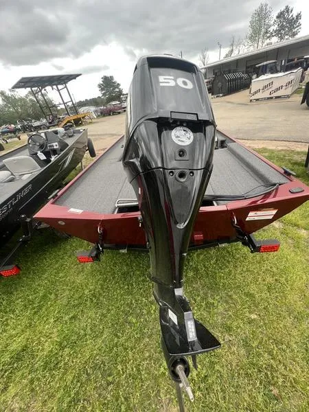 Slide: The Image of 2023 Crestliner 1600 Storm boat with 50 HP outboard motor, rear view. - 9