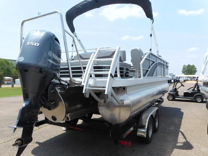 Slide: The Image of 2023 Bennington 22 SXSB pontoon boat with Yamaha 150 engine on trailer. - 4