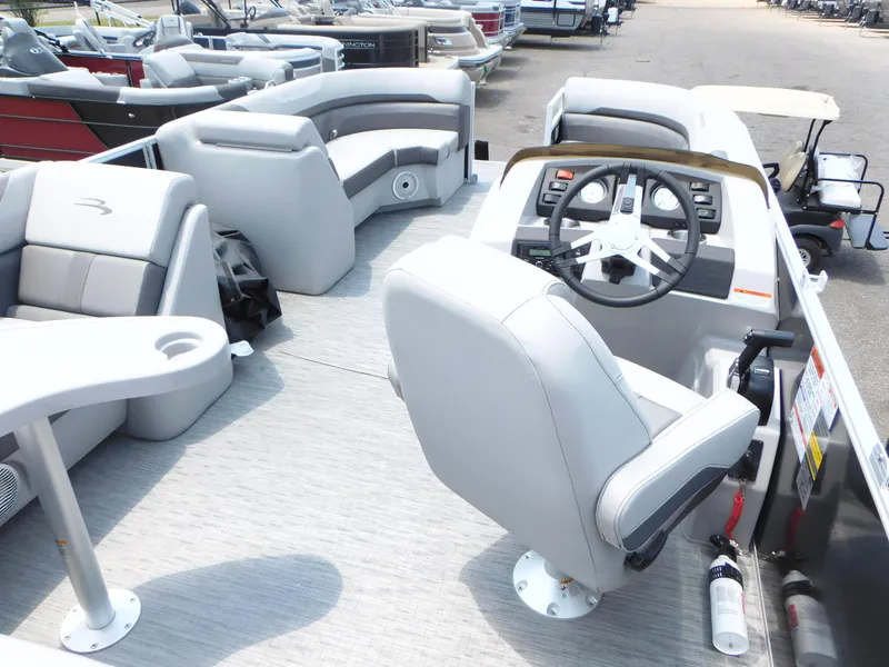 Slide: The Image of 2023 Bennington 22 SXSB pontoon boat interior with helm and seating. - 8