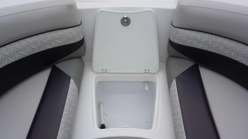Slide: The Image of Open storage compartment on 2023 Hurricane 2690 SD boat with cushioned seating. - 14