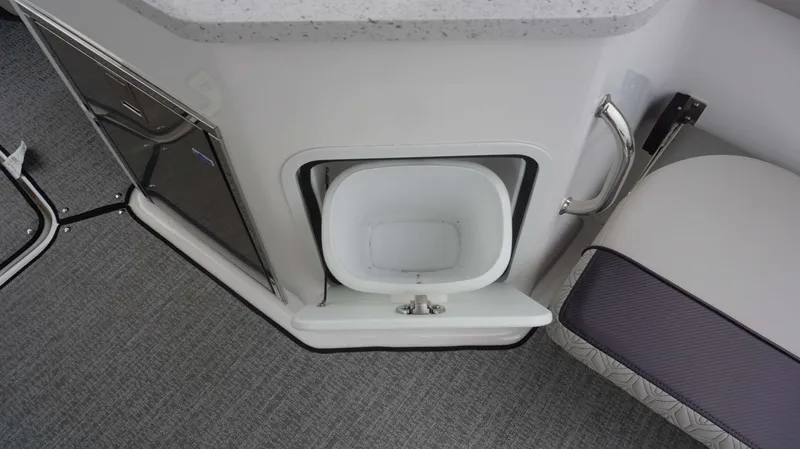 Slide: The Image of Interior of 2023 Hurricane 2690 SD boat showing storage compartment and seating. - 16
