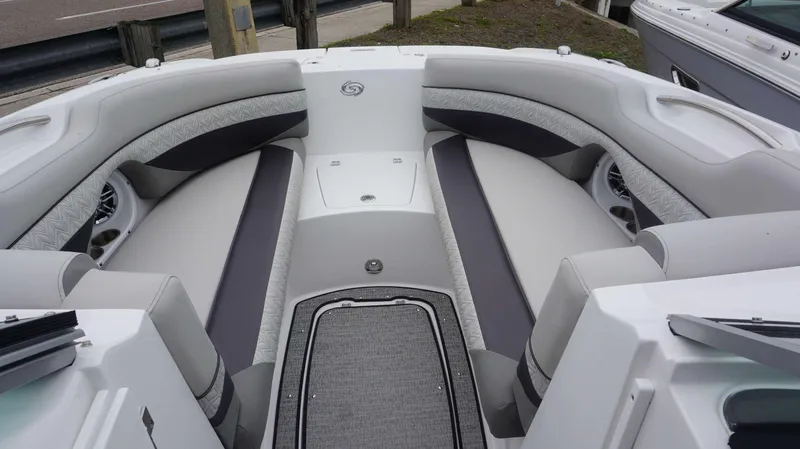 Slide: The Image of 2023 Hurricane 2690 SD boat interior with cushioned seating and storage compartments. - 20