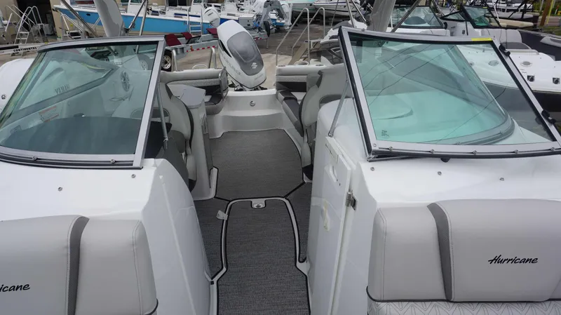 Slide: The Image of 2023 Hurricane 2690 SD boat interior with seating and windshield. - 22