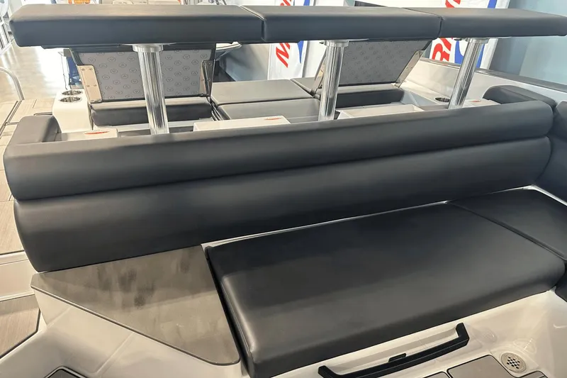 Slide: The Image of 2023 Aviara AV32 boat interior seating with sleek black upholstery and modern design. - 10