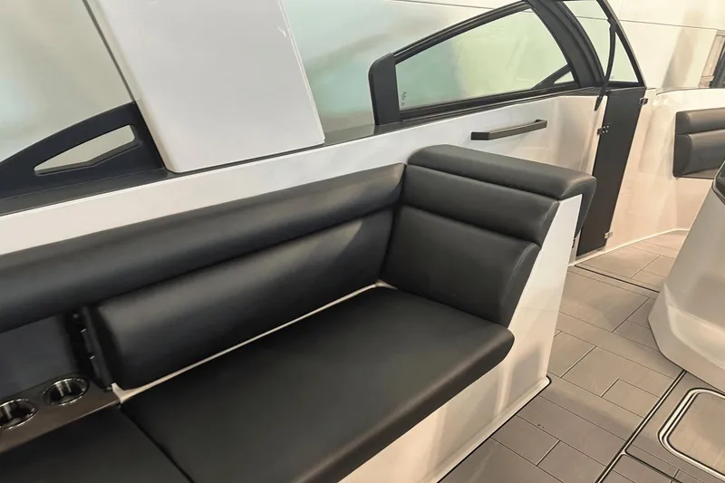Slide: The Image of 2023 Aviara AV32 boat interior with sleek black seating and modern design. - 12